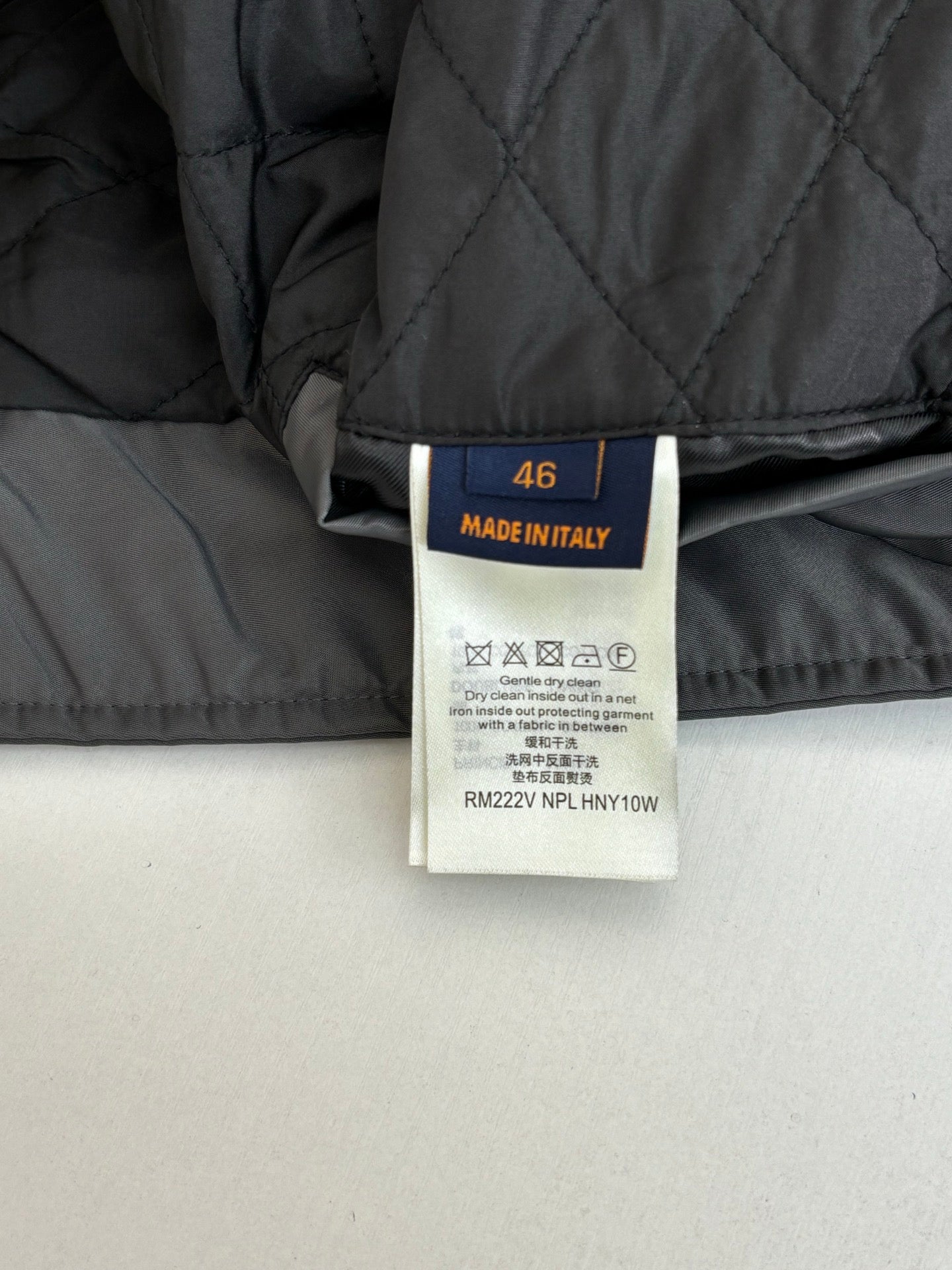 Long jacket interior label showing size 40 and Made in Italy