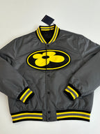 Louis Vuitton bomber jacket in dark gray with yellow logo patch and striped ribbed trim