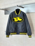 Louis Vuitton bomber jacket in dark gray with yellow logo and ribbed striped cuffs