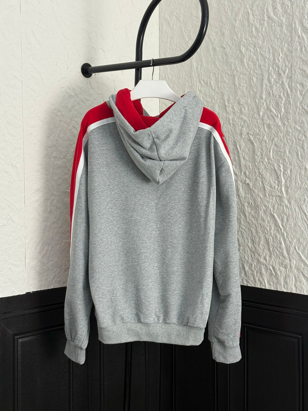 Gray Louis Vuitton hoodie with red sleeve stripes and hood