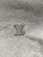 Louis Vuitton LV logo patch on gray hoodie fabric