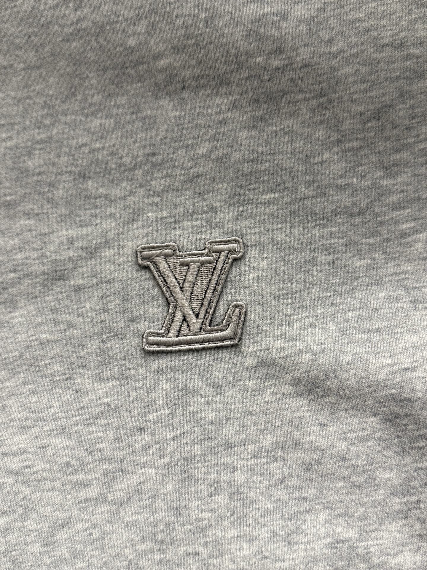 Louis Vuitton LV logo patch on gray hoodie fabric