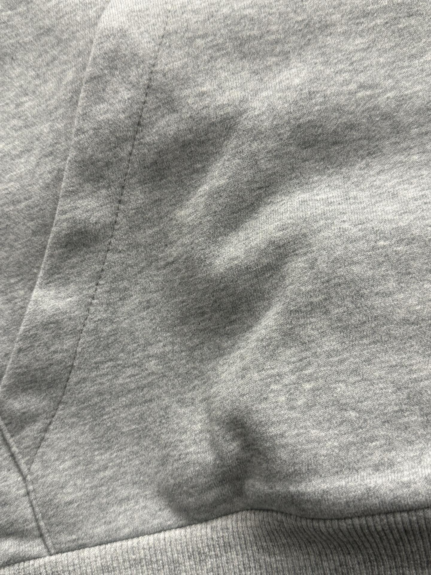 Gray hoodie hood and seam detail
