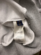 Gray hoodie neckline with size and care label