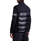 Moncler puffer jacket with navy knit sleeves and black quilted back panel, stripe detail