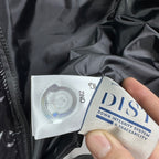 Down puffer jacket interior label reading iDS and traceability details