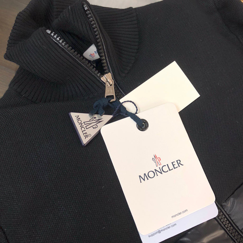 Moncler ribbed knit zip sweater with attached tags and navy sleeve stripe