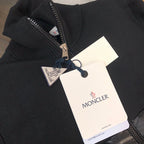 Moncler ribbed knit zip sweater with attached tags and navy sleeve stripe