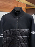 Moncler zip puffer jacket with navy ribbed collar and black quilted front panel