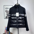 Moncler down puffer jacket with knit sleeves, striped cuffs, and front zip closure