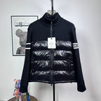 Moncler down puffer jacket with knit sleeves, striped cuffs, and front zip closure