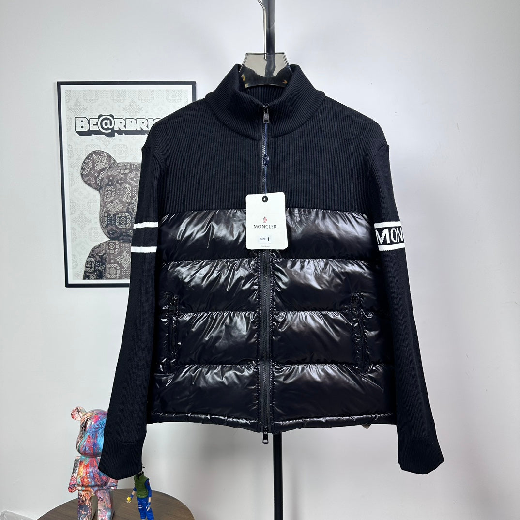 Moncler down puffer jacket with knit sleeves, striped cuffs, and front zip closure