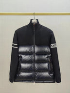 Down puffer jacket with knit sleeves, horizontal quilting, and front zipper on hanger