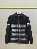 Down puffer jacket front view with stand collar, horizontal quilting, and zip closure