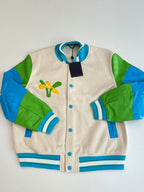 Louis Vuitton button-up jacket, front view, cream body with green and blue sleeve panels
