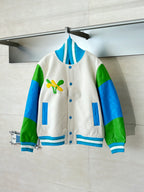 Louis Vuitton button-up jacket in cream with green/blue sleeves and blue striped ribbing