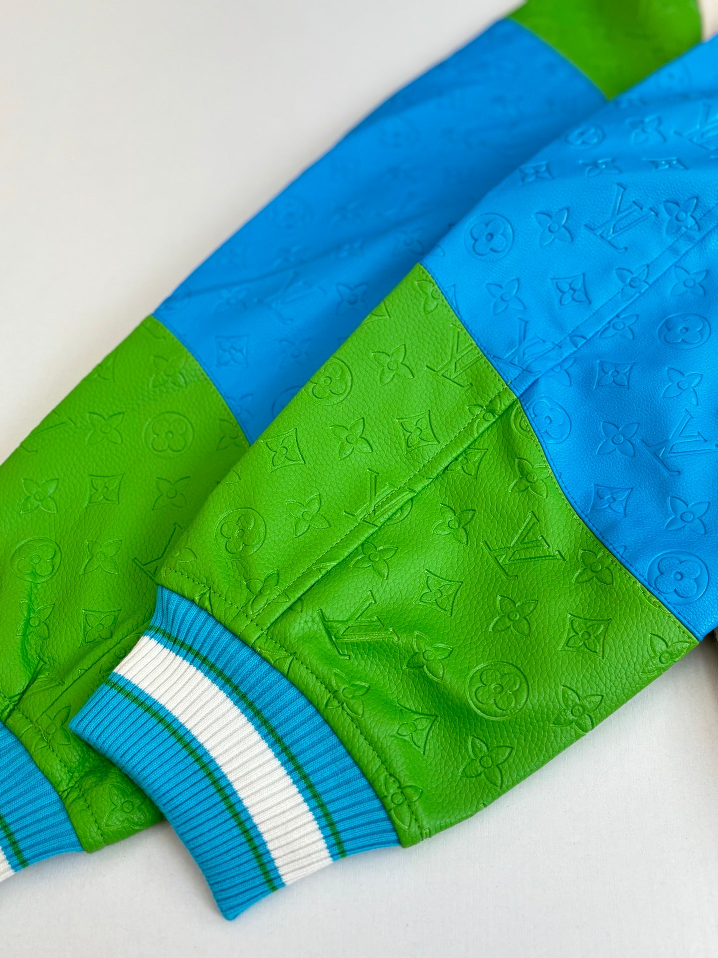 Louis Vuitton long-sleeve knit sweater, green and blue with embossed monogram pattern