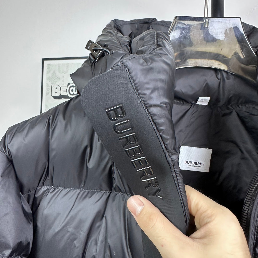 Long puffer jacket with Burberry logo patch and vertical branding, dark gray