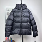 Long hooded puffer jacket, dark color, full-zip front with ribbed cuffs