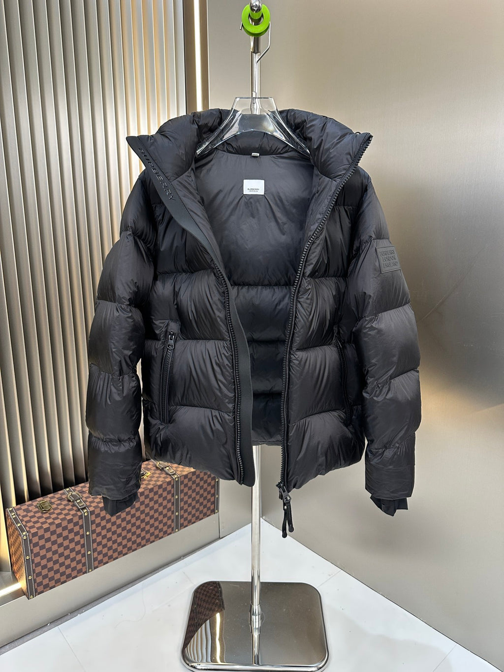 Burberry long padded jacket with hood, front zipper, and structured puffer sleeves, dark navy