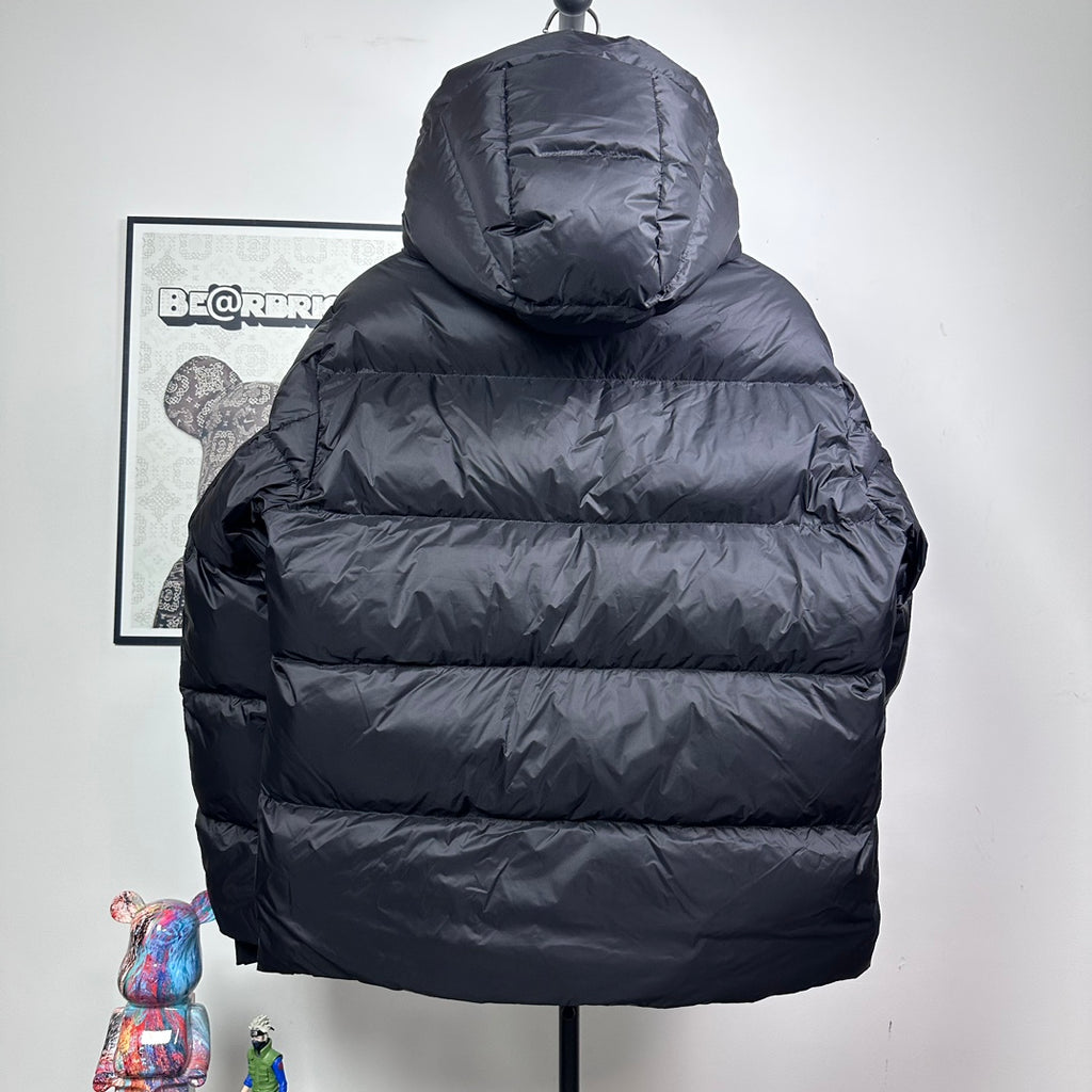 Long hooded puffer jacket, dark color, quilted back view with full-length zipper