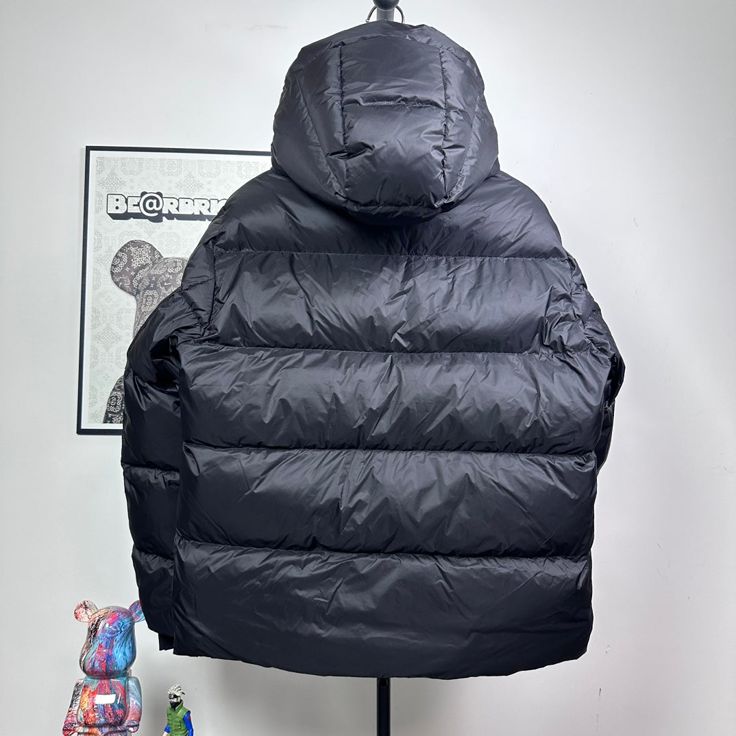 Long hooded puffer jacket, dark color, quilted back view with full-length zipper