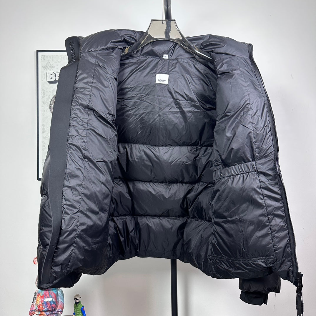 Long hooded puffer jacket, dark color, inside lining visible through open front