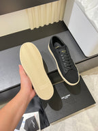 Saint Laurent unisex sneakers showing outsole, dark gray uppers with cream tread