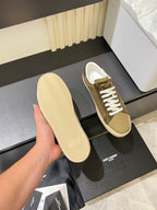 YSL unisex sneakers with visible textured sole, tan upper and brown side panels