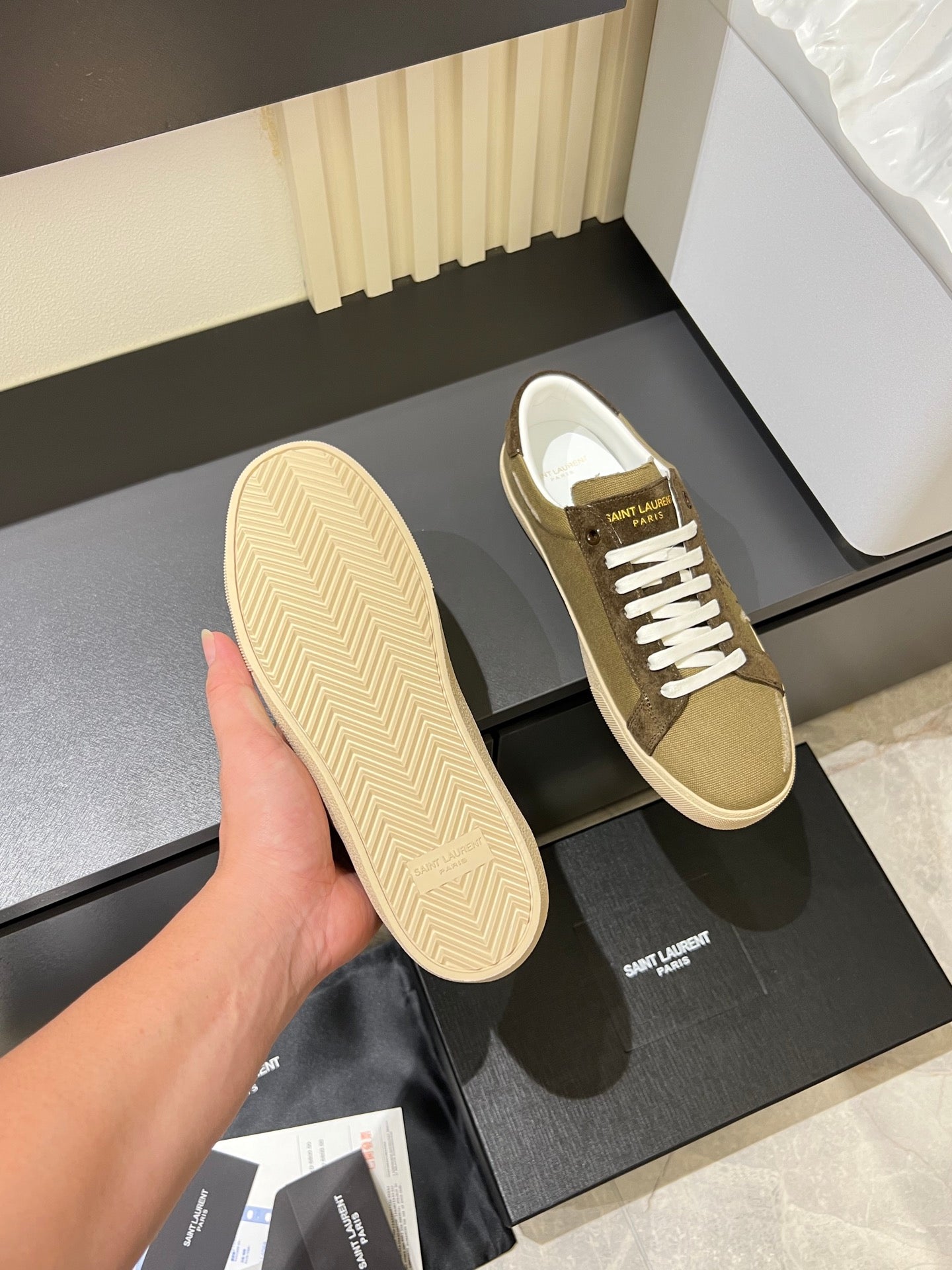 YSL unisex sneakers with visible textured sole, tan upper and brown side panels