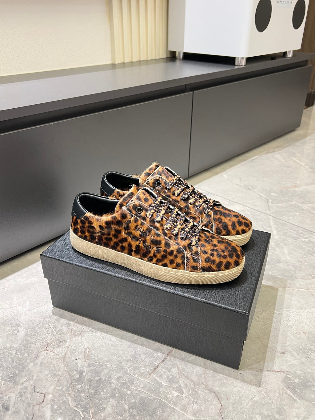 YSL leopard-print sneakers with white rubber sole, lace-up front on box