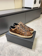 YSL leopard-print sneakers with white rubber sole, lace-up front on box
