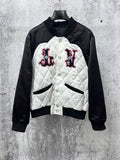 Quilted black-and-white jacket with button front and logo patches