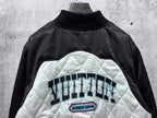 Black-and-white quilted jacket with large back graphic and ribbed turtleneck collar