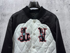 Black-and-white quilted jacket with embroidered red-and-black logo and snap buttons