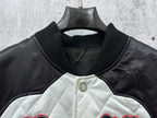 Quilted jacket with ribbed collar, snap buttons, and small gold chain detail