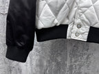 Quilted jacket sleeve with ribbed cuff and snap-detailed white front panel