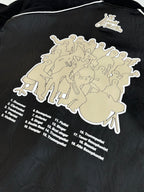 Louis Vuitton long jacket back close-up, black with large cream graphic and list text