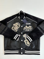 Louis Vuitton long jacket front view, black with cream crest patches and striped ribbing