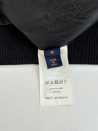 Size M tag on black knit garment, made in Italy, care label