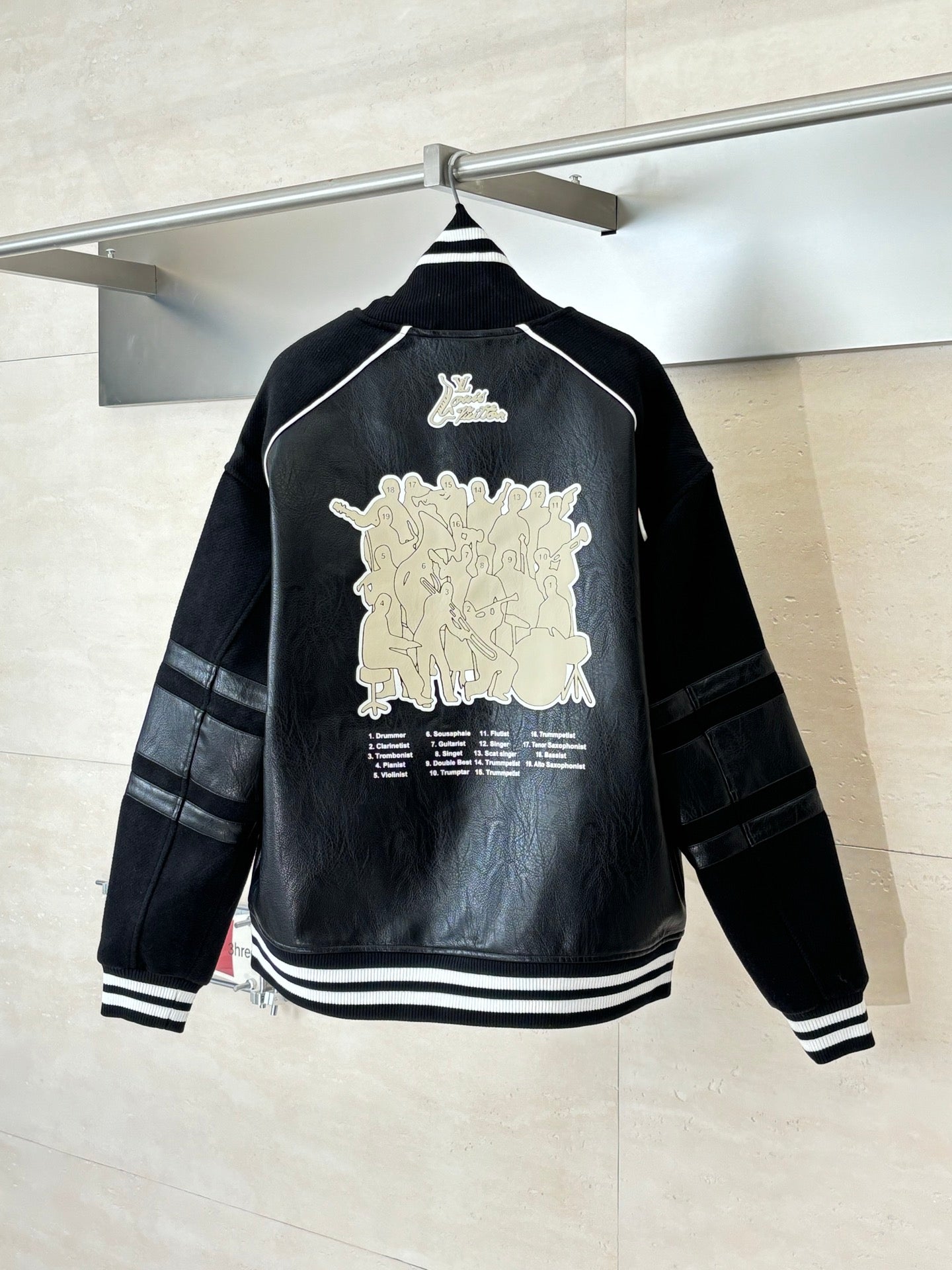 Louis Vuitton long jacket, black back with large cream graphic print and striped cuffs