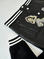 Louis Vuitton long jacket, black with cream logo patch, welt pocket and striped trim