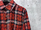 Red plaid long-sleeve button-up shirt collar with dark floral pattern