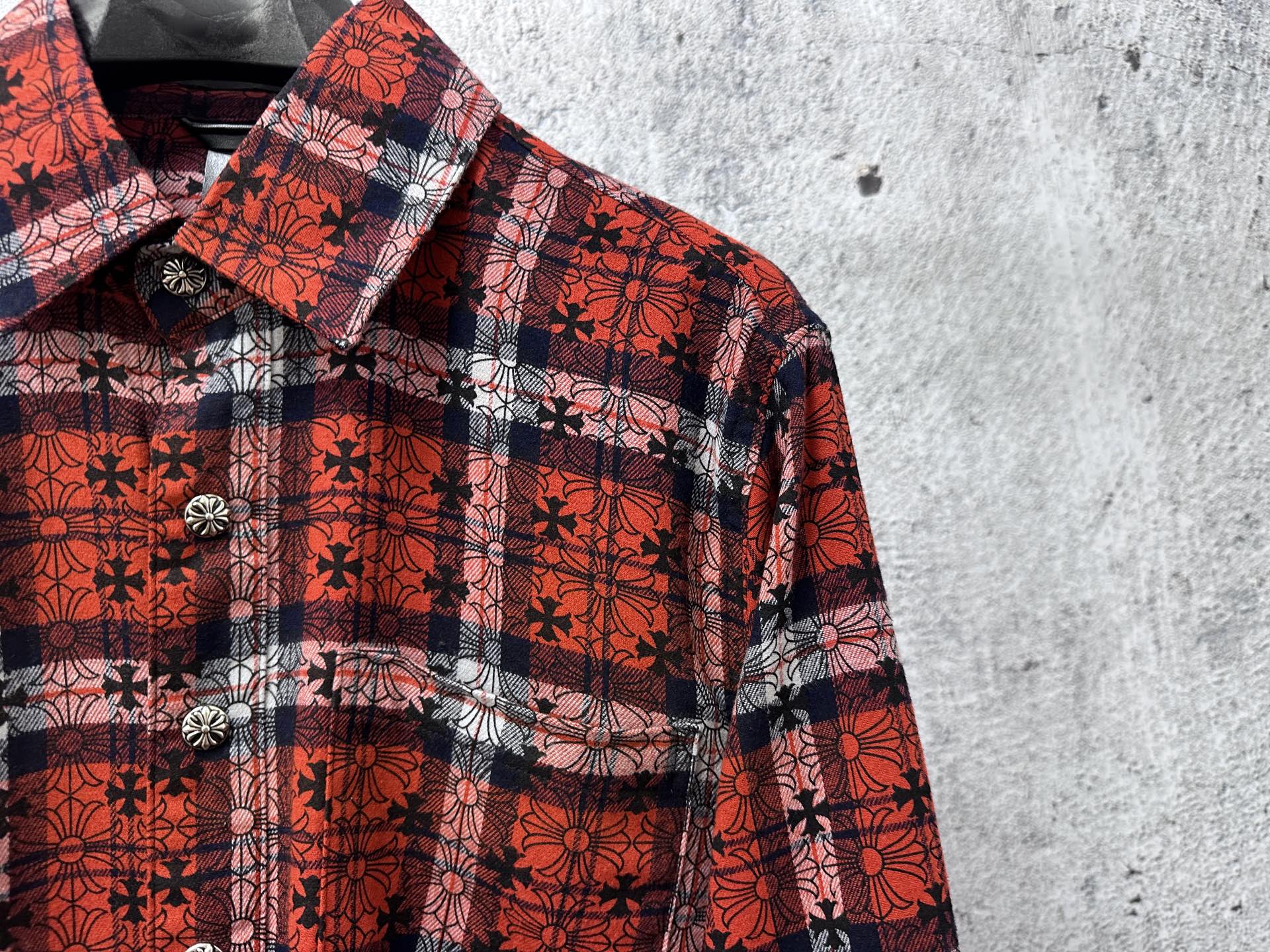 Red plaid long-sleeve button-up shirt collar with dark floral pattern