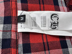 Plaid shirt care label with size tag and washing symbols