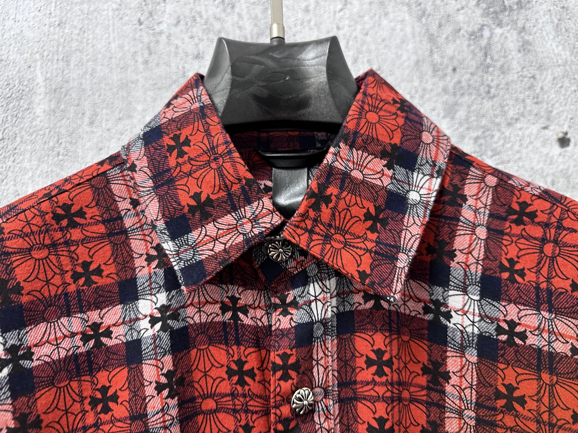 Red plaid long-sleeve button-up shirt with floral pattern and button placket