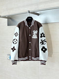 Louis Vuitton brown long jacket with white sleeves, button front, and large logo patches