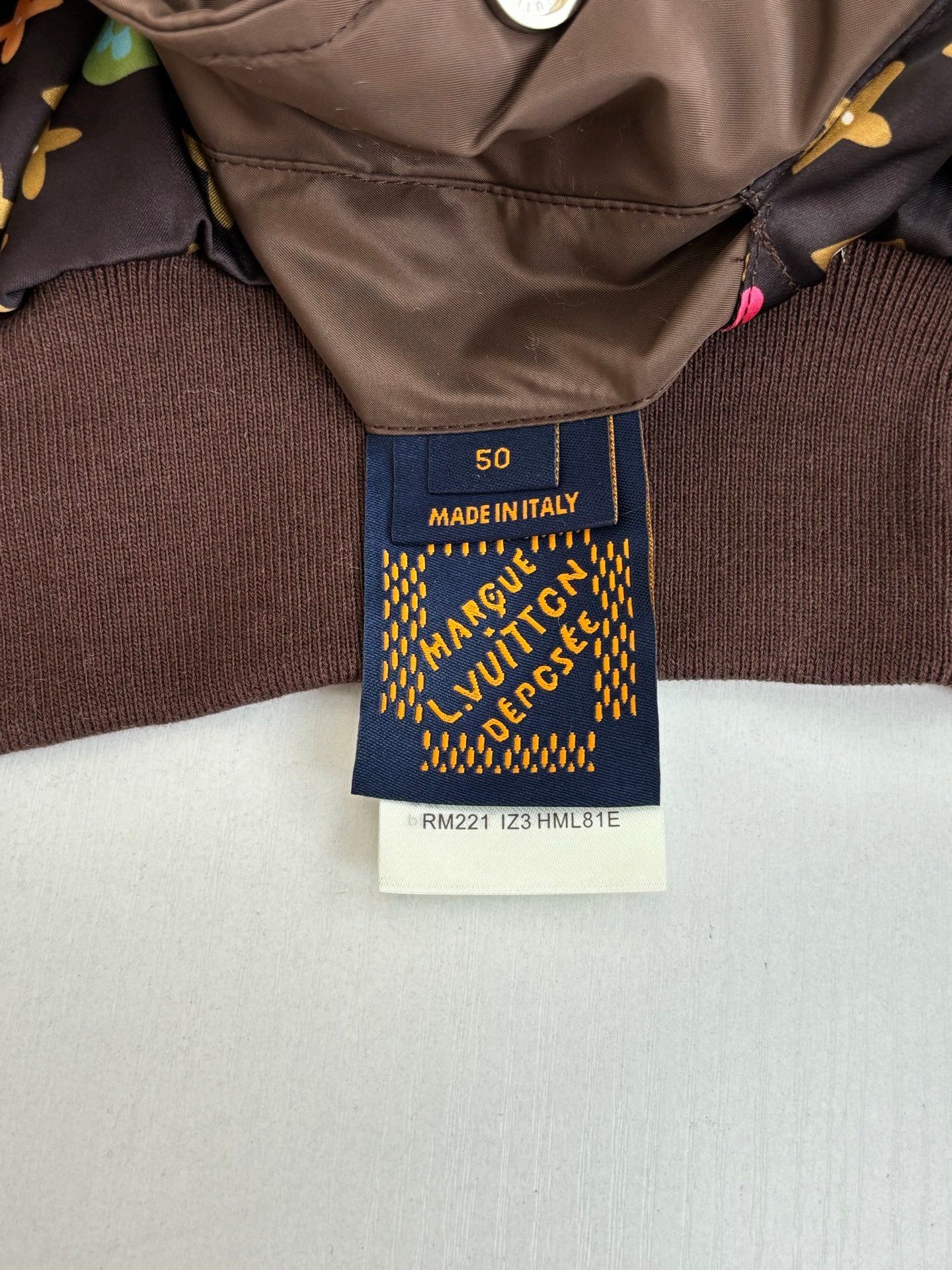 Brown knit garment with interior Made in Italy label