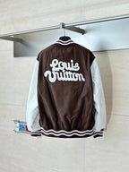 Louis Vuitton brown long jacket back with bold “Louis Vuitton” lettering and striped trim