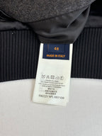 Size 48 "Made in Italy" care label on dark ribbed cuff of varsity jacket